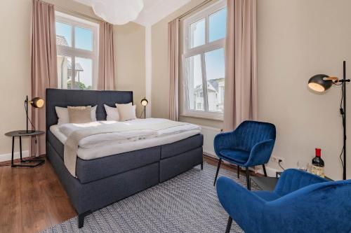 Un pat sau paturi într-o cameră la Villa Carmen Seebrücke