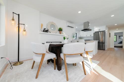 a kitchen and dining room with a table and chairs at #Marbella Lane - Classy 3BR Jewel with Open Vibe in Yorba Linda