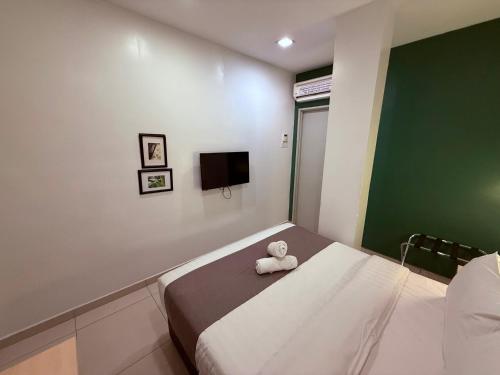 Postel nebo postele na pokoji v ubytování Eco Roomy Hotel