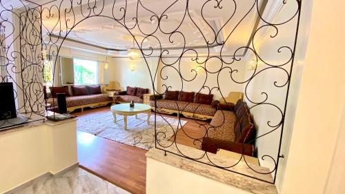 a living room with a large wrought iron gate at Iconic 2 Bedroom Apartment in Tangier