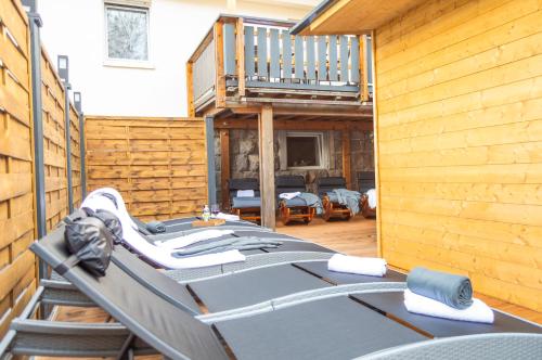 a room with a deck with a bed and a balcony at Ferienwohnung Wellnessblick - Nähe Triberger Wasserfälle in Triberg