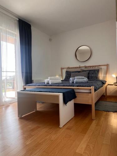 a bedroom with a large bed with a mirror on the wall at Villa Lavanda in Vodnjan