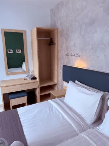 Postel nebo postele na pokoji v ubytování Eco Roomy Hotel