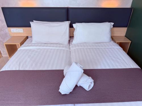 Postel nebo postele na pokoji v ubytování Eco Roomy Hotel