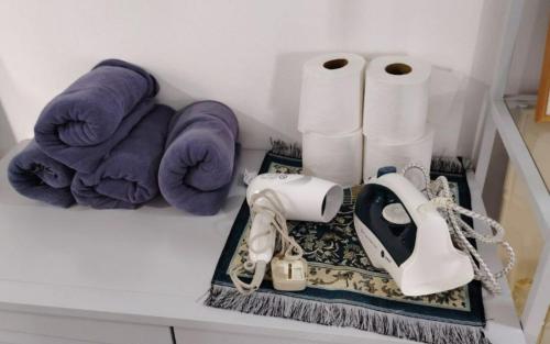 a counter with towels towels and a telephone on it at YUYU B2 Honeymoon WiFi Genting highland in Genting Highlands