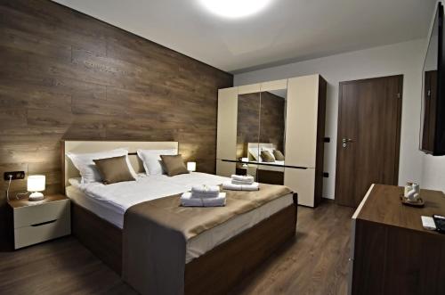 Giường trong phòng chung tại Libertè suites Velingrad