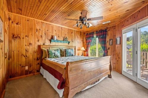 a bedroom with a bed and a ceiling fan at Mountains 4 Miles By Avada Properties in Gatlinburg