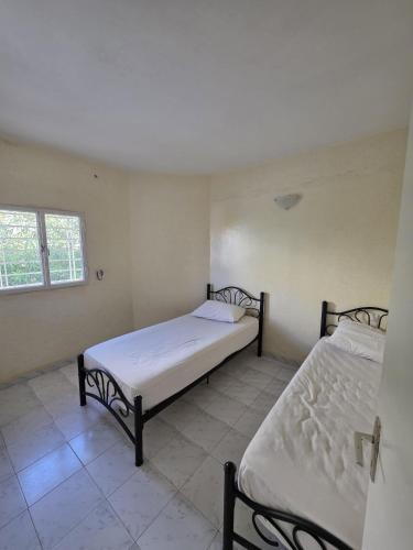Katil atau katil-katil dalam bilik di Résidence hacienda 2 sidi bouzid