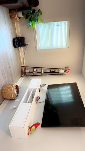 a white kitchen with a sink and a window at 4BR Ocean Springs Home with Luxury Amenities in Ocean Springs