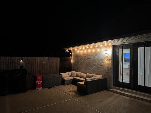 a couch sitting on the side of a building at night at 4BR Ocean Springs Home with Luxury Amenities in Ocean Springs