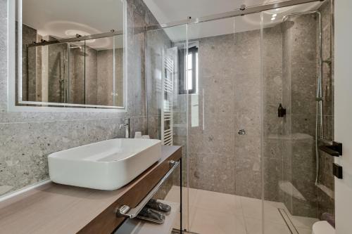 a bathroom with a sink and a shower at PREVEZA VILLA center in Preveza