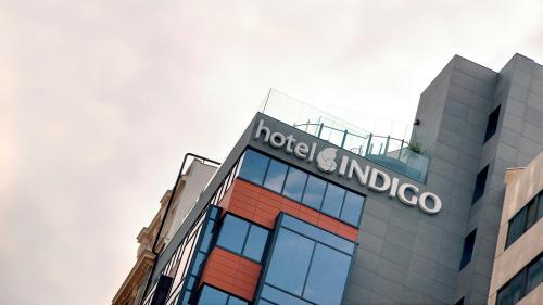 a sign on the top of a building at Hotel Indigo Madrid - Gran Vía by IHG in Madrid