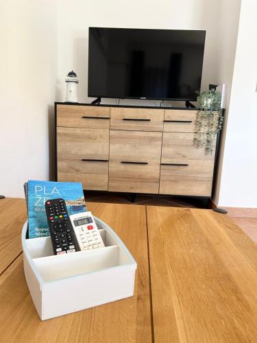 Televisyen dan/atau pusat hiburan di Apartment ADEPTO
