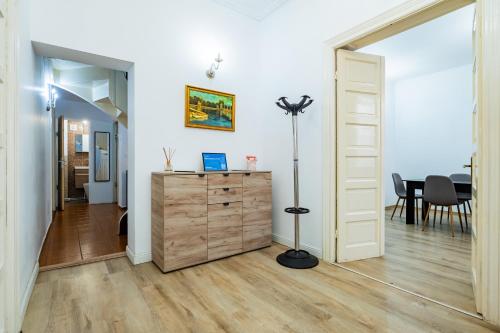 a room with a dresser and a dining room at Villa Dumbrava Rosie in Constanţa