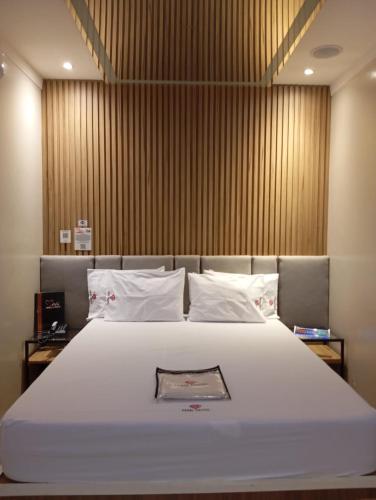 Katil atau katil-katil dalam bilik di Mais Motel e Hotel
