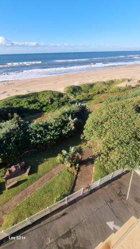 a view of the beach from the balcony of a condo at Albatros 506 in Amanzimtoti