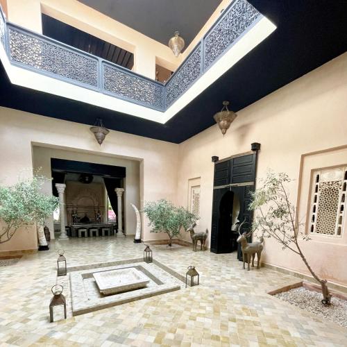 a large room with a tub in the middle of a building at Villa Jude Luxury 6BR Villa with Private Pool, Sleeps 12, Near Golf & City in Marrakesh