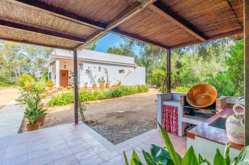 an outdoor kitchen with a view of a house at Sa Rota de can Xito in Sencelles
