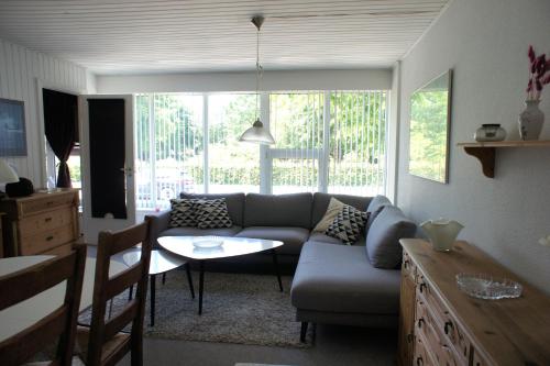 a living room with a couch and a table at Svendsgade 80 ground floor door 2 id 78 in Esbjerg