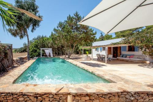 an image of a swimming pool in a house at Casa Mayo in Sant Francesc Xavier