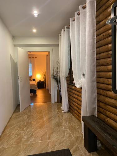 a hallway with white curtains in a room at Countryside double bed room Kisiniai in Kisiniai