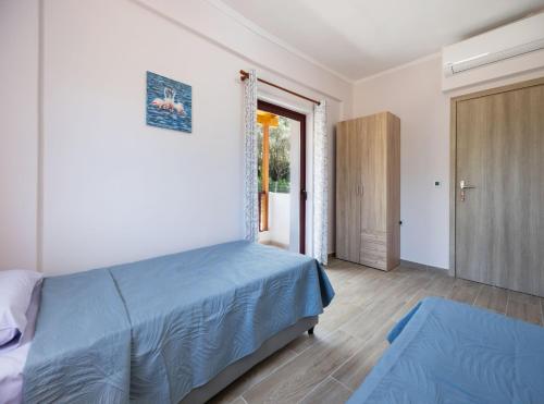 Postel nebo postele na pokoji v ubytování Jim's villa
