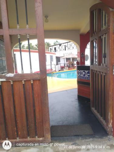 an inside view of a house with a pool at Hospedaje con vista ala laguna de huacachina refugio en el oasis in Ica