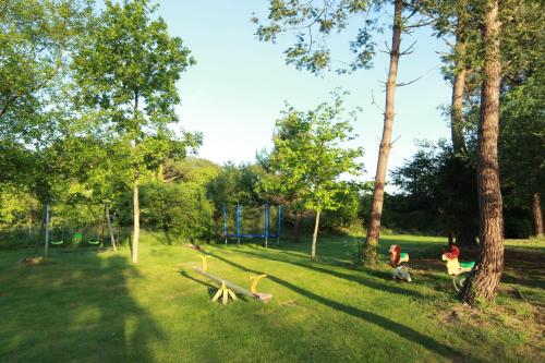 a group of children playing in a park at Chambres du Bout du Monde in Landévennec