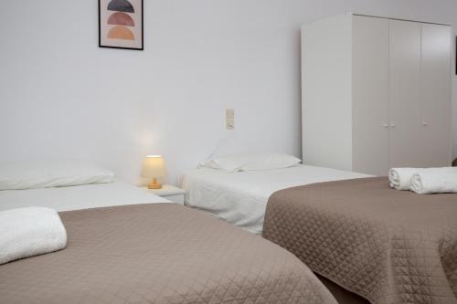 Ένα ή περισσότερα κρεβάτια σε δωμάτιο στο Ferma Solaris Apartments