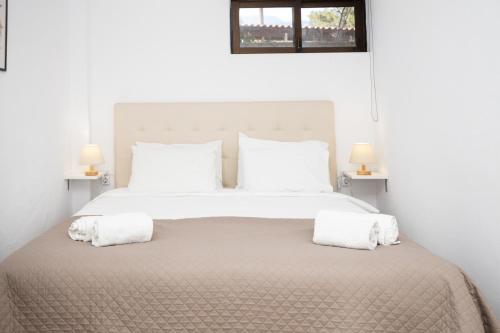 Ένα ή περισσότερα κρεβάτια σε δωμάτιο στο Ferma Solaris Apartments