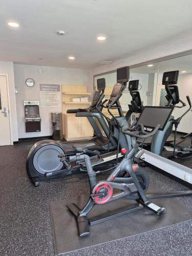 a gym with several exercise bikes in a room at Spark by Hilton Lancaster in Lancaster