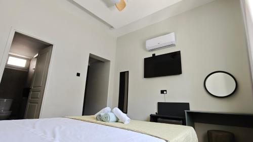 Postel nebo postele na pokoji v ubytování St Lazarus City Hotel
