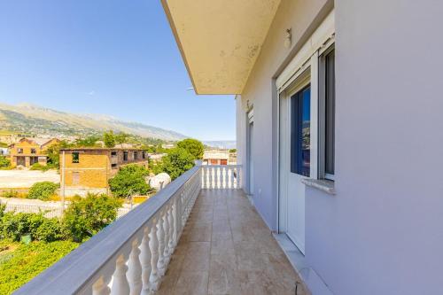 a balcony with a view of a city at Hometown Apartment 2 in Gjirokastër