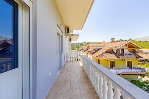 a balcony with a view of a house at Hometown Apartment 2 in Gjirokastër