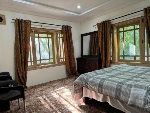 Ένα ή περισσότερα κρεβάτια σε δωμάτιο στο Marhaba Guest House Skardu
