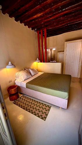 a bedroom with a large bed in a room at Amerissas studios 3 in Skiros