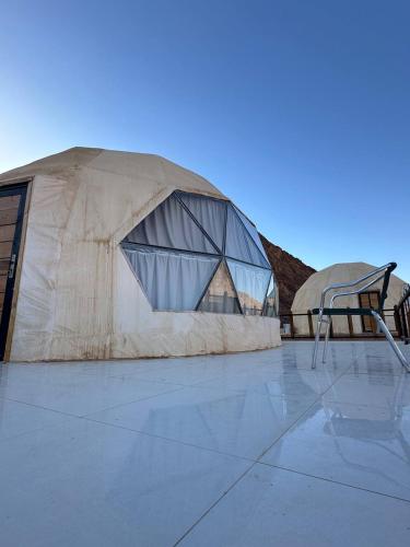 a building with a basketball hoop in front of it at Camp Imran Khan Wadi Rum in Aqaba