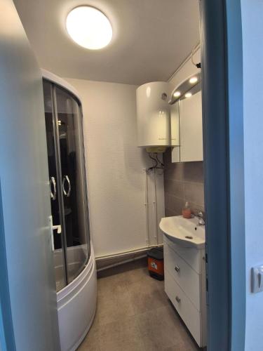 a bathroom with a sink and a mirror at Casa Elena in Eforie Sud