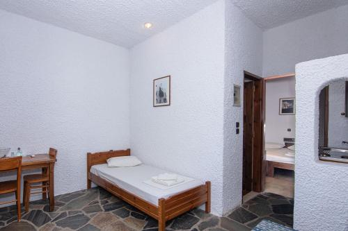 Una cama o camas en una habitación de Delfini Apartments