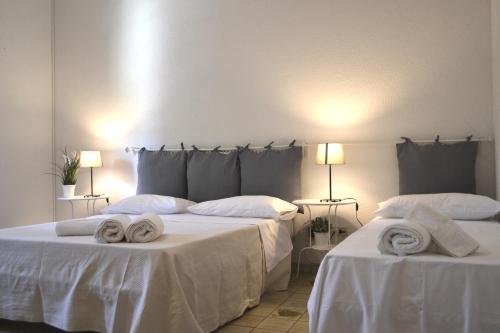 Postel nebo postele na pokoji v ubytování La Frantoiana