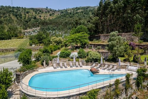 an overhead view of a swimming pool with lounge chairs at Fountain Retreat I Pool, Jacuzzi & Sports Escape in Viana do Castelo