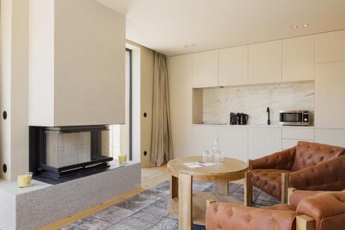 a living room with a couch and a table at Dajas Douro Valley - Exclusive Villas in Sande
