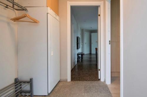 a hallway with a hallway leading to a room with at Lägenhet i Klövsjö in Herräng