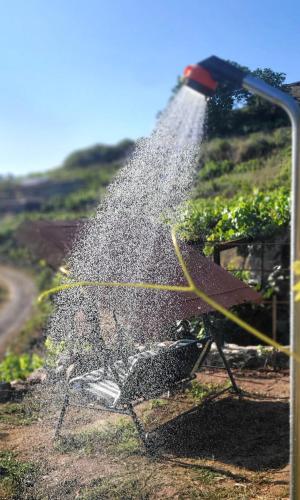 a hose is being used to water a garden at cabaña do rei in Betán