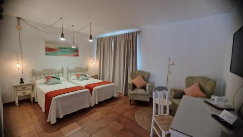 Katil atau katil-katil dalam bilik di Hotel Los Olivos