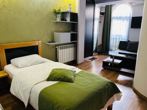 Postel nebo postele na pokoji v ubytování Hotel Kiwi Garden