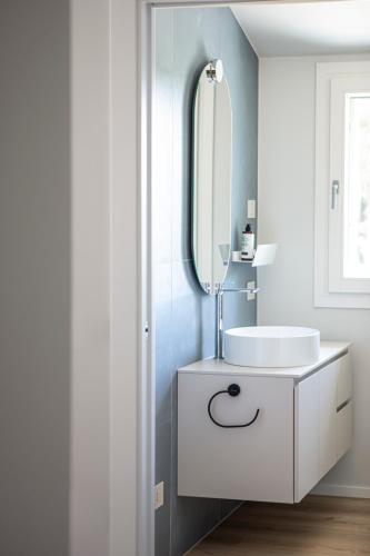 a bathroom with a white sink and a mirror at Ca' Allegra in Mogliano Veneto