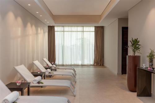 a row of white chairs in a waiting room at Radisson Blu Hotel, Conakry in Conakry
