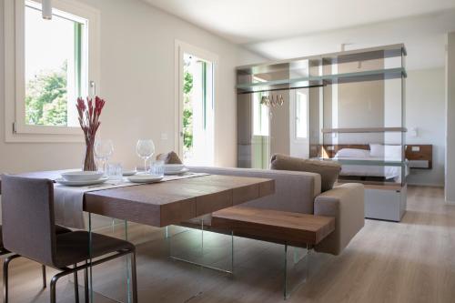 a living room with a table and a couch at Ca' Allegra in Mogliano Veneto