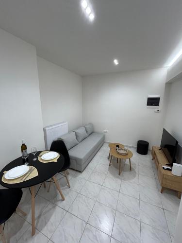 a living room with a couch and a table at SK Apartment II in Perea